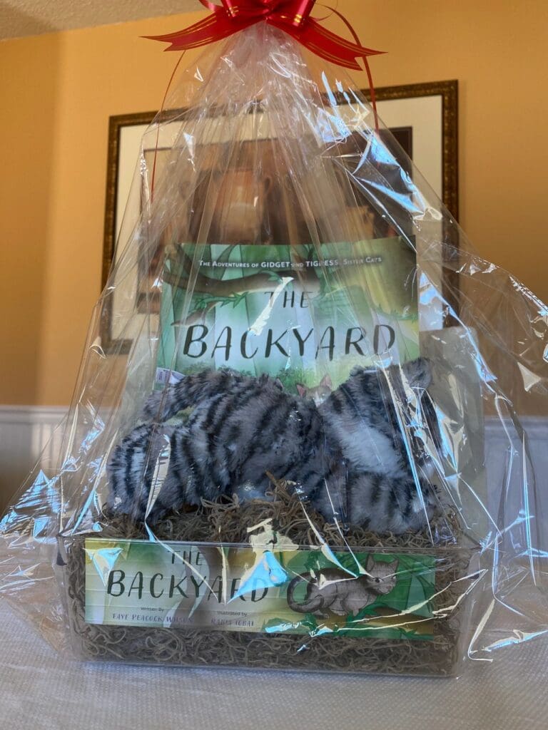 A gift basket with a cat in it.