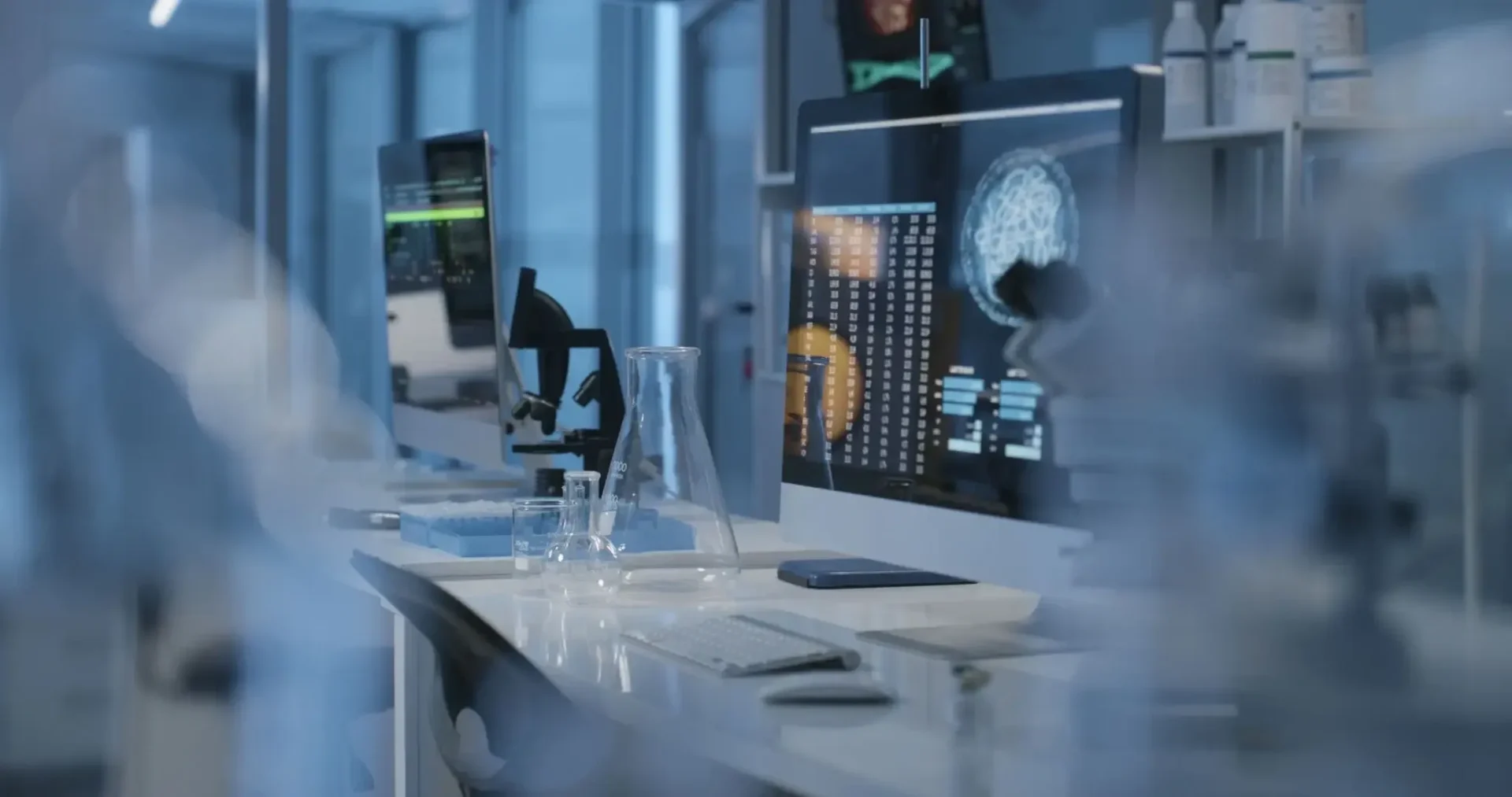 Modern laboratory with computers and glassware.
