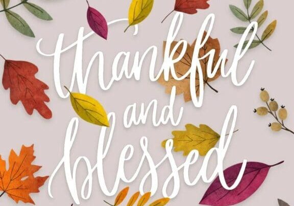 Thanksgiving card with colorful leaves and the words thankful and blessed.